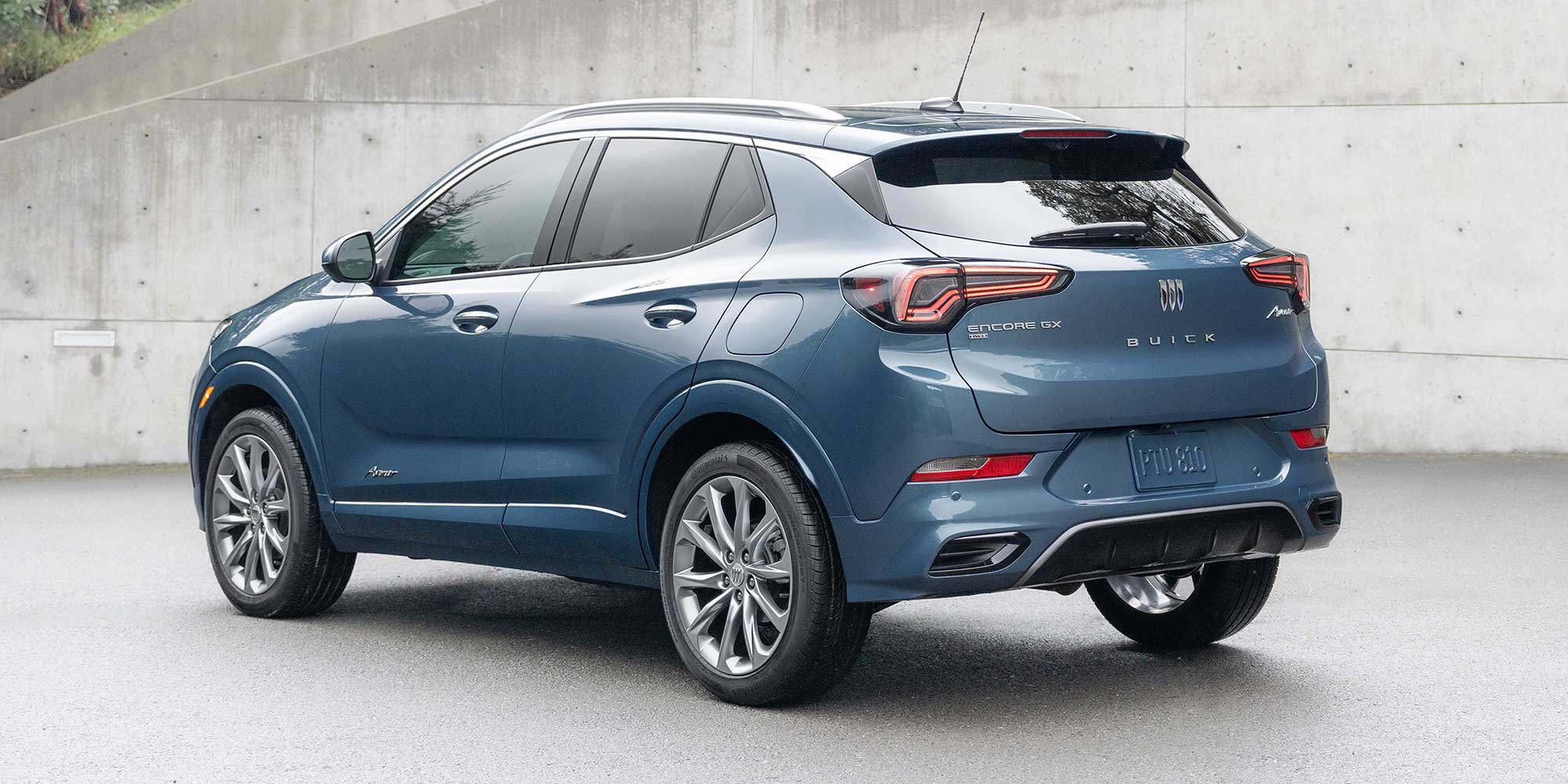 Rear Three-Quarters View of the 2026 Buick Encore GX Small SUV Parked in a Driveway
