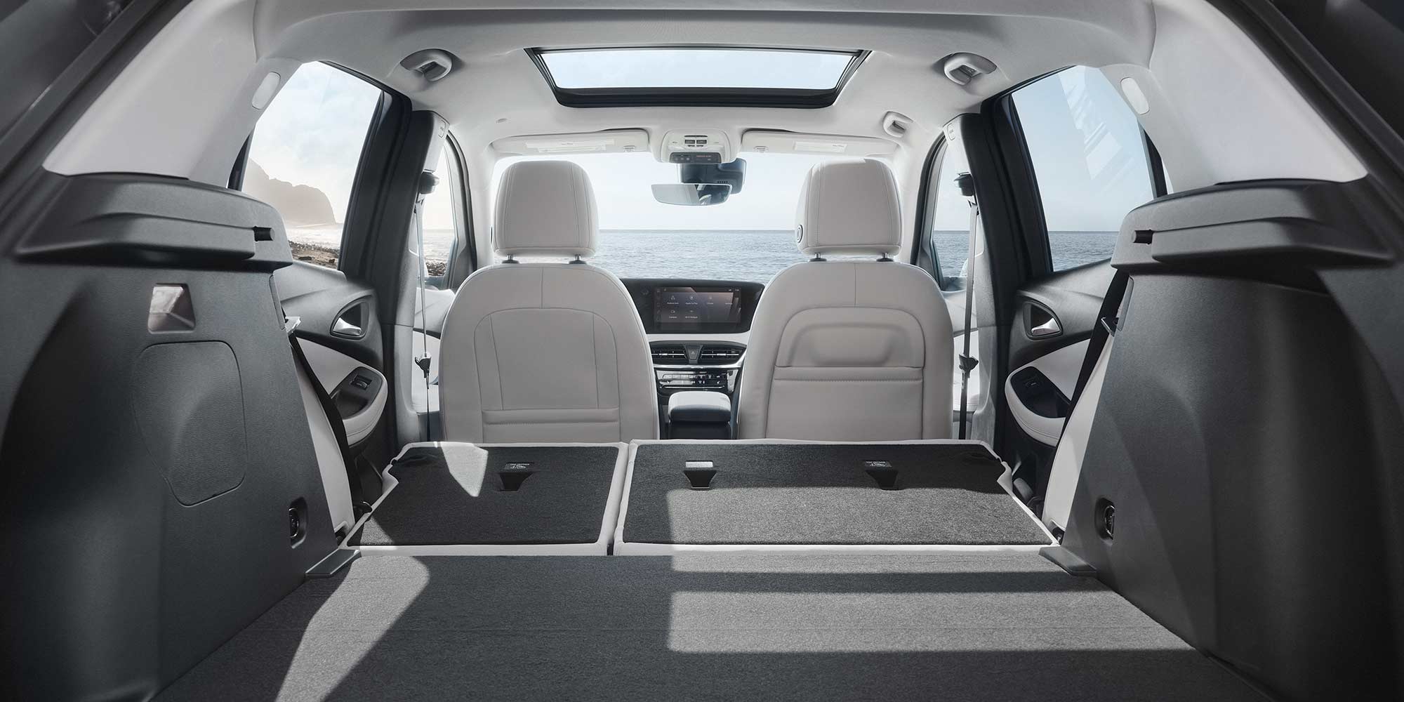 Interior View From the Rear of the Buick 2026 Encore GX Small SUV with the Rear Seats Folded Down