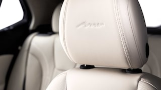 Close-up of the Avenir Badging on the Headrest in the 2026 Buick Encore GX Avenir Luxury SUV