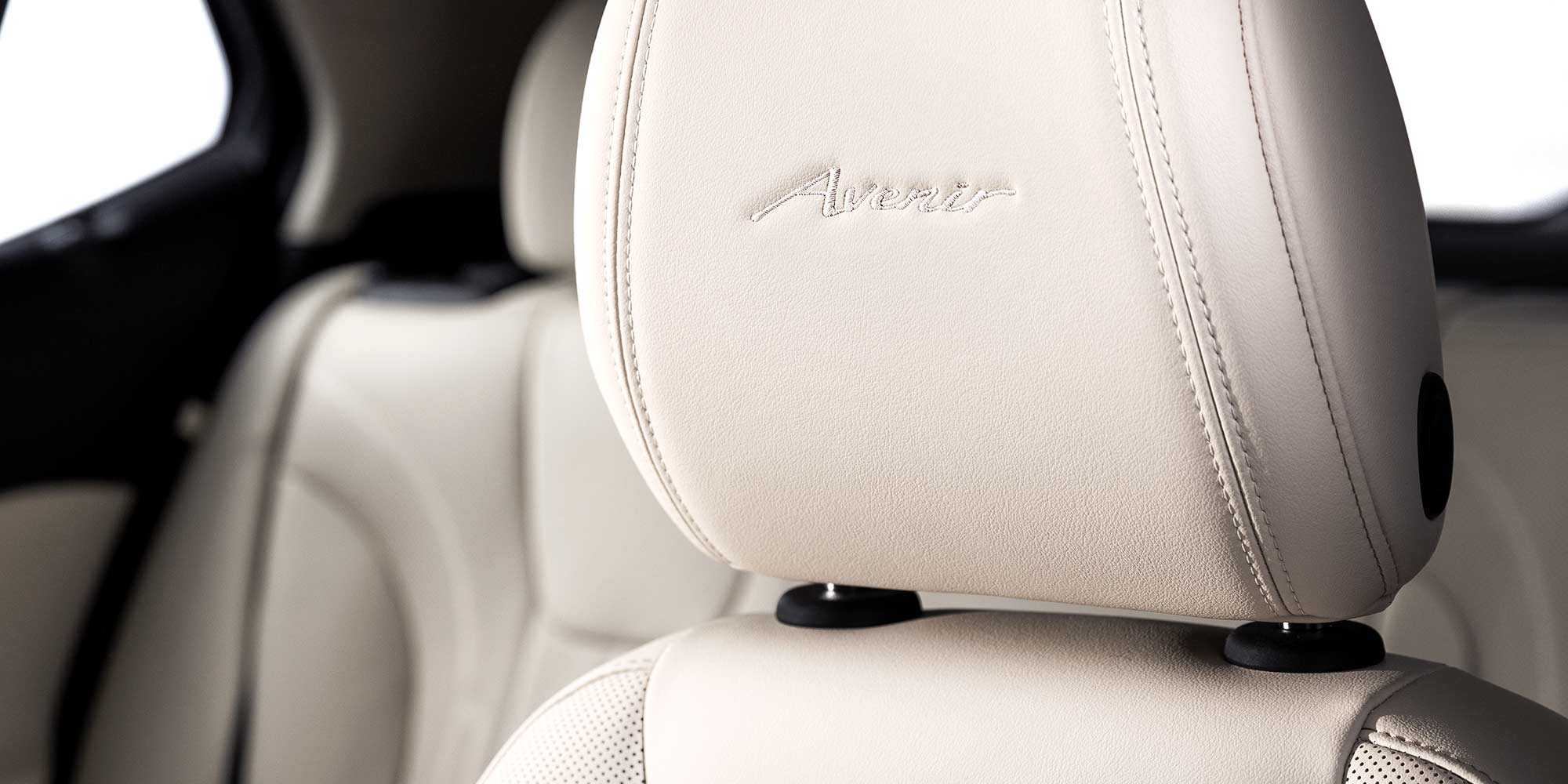 Close-up of the Avenir Badging on the Headrest in the 2026 Buick Encore GX Avenir Luxury SUV