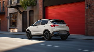 Rear View of the 2026 Buick Encore GX Sports Touring SUV Parked on a City Street