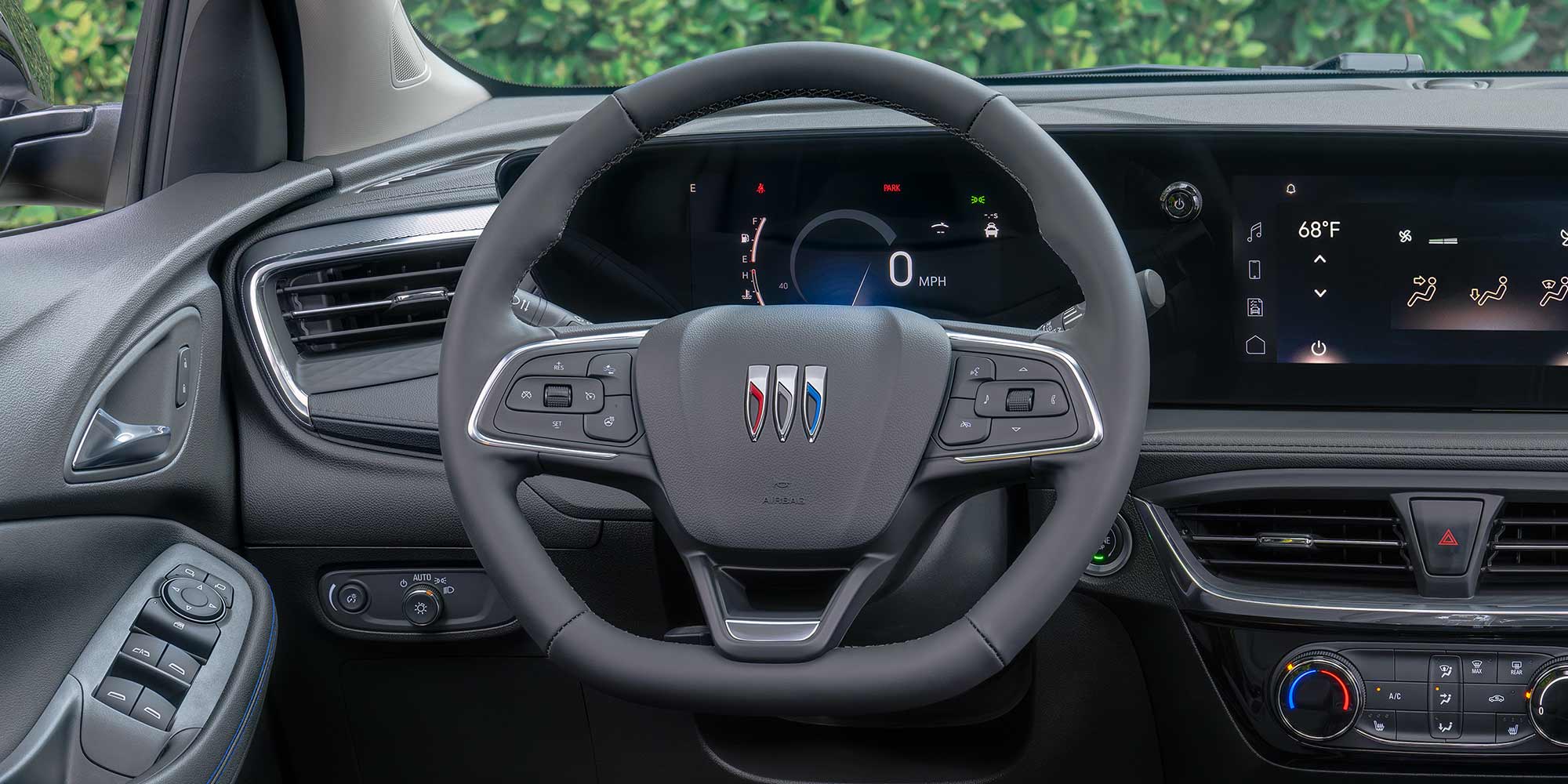 Interior View of the Buick 2026 Encore GX Small SUV's Dashboard, Steering Wheel, and Infotainment Display