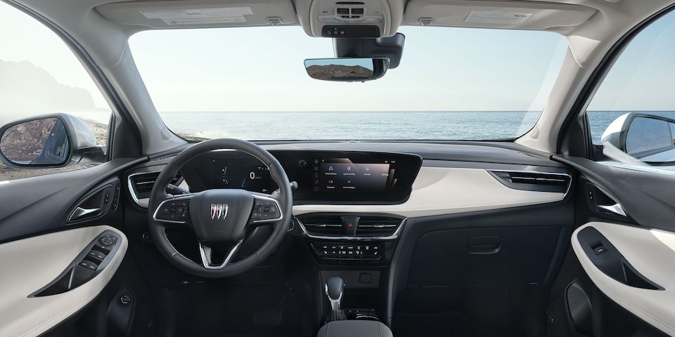 View of the 2026 Buick Encore GX Small SUV Light Interior Dashboard, Steering Wheel, and Infotainment Screen