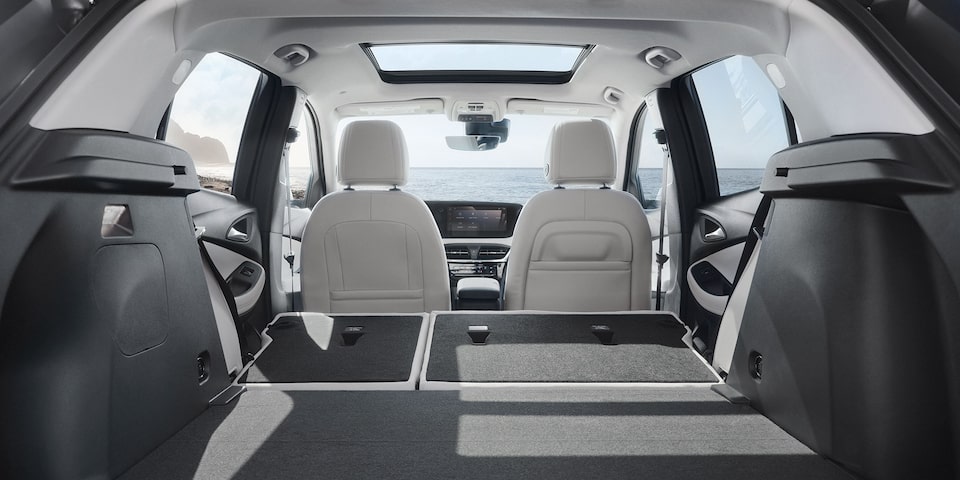 Interior View From the Opened Rear Tailgate of the 2026 Buick Encore GX Small SUV with the Rear Seats Folded Down