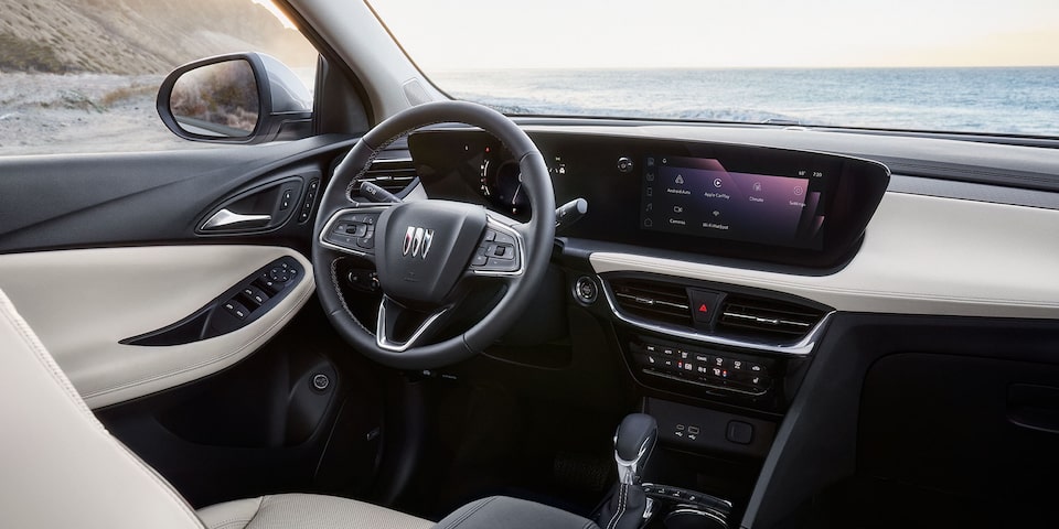 View of the 2026 Buick Encore GX Small SUV Light Interior Steering Wheel and Infotainment Screen