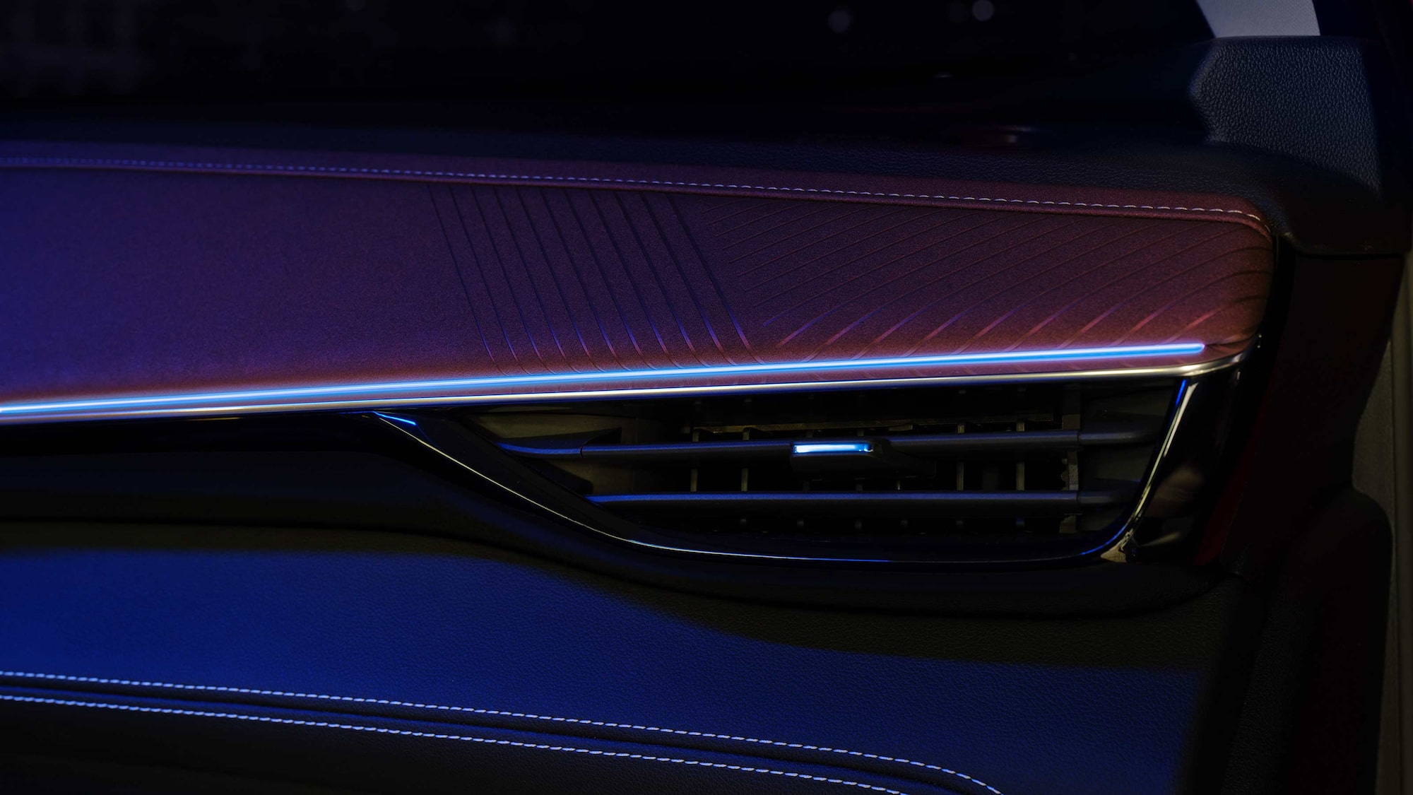 Close-up of the Air Vent in the 2026 Buick Envision with a Blue and Purple Hue