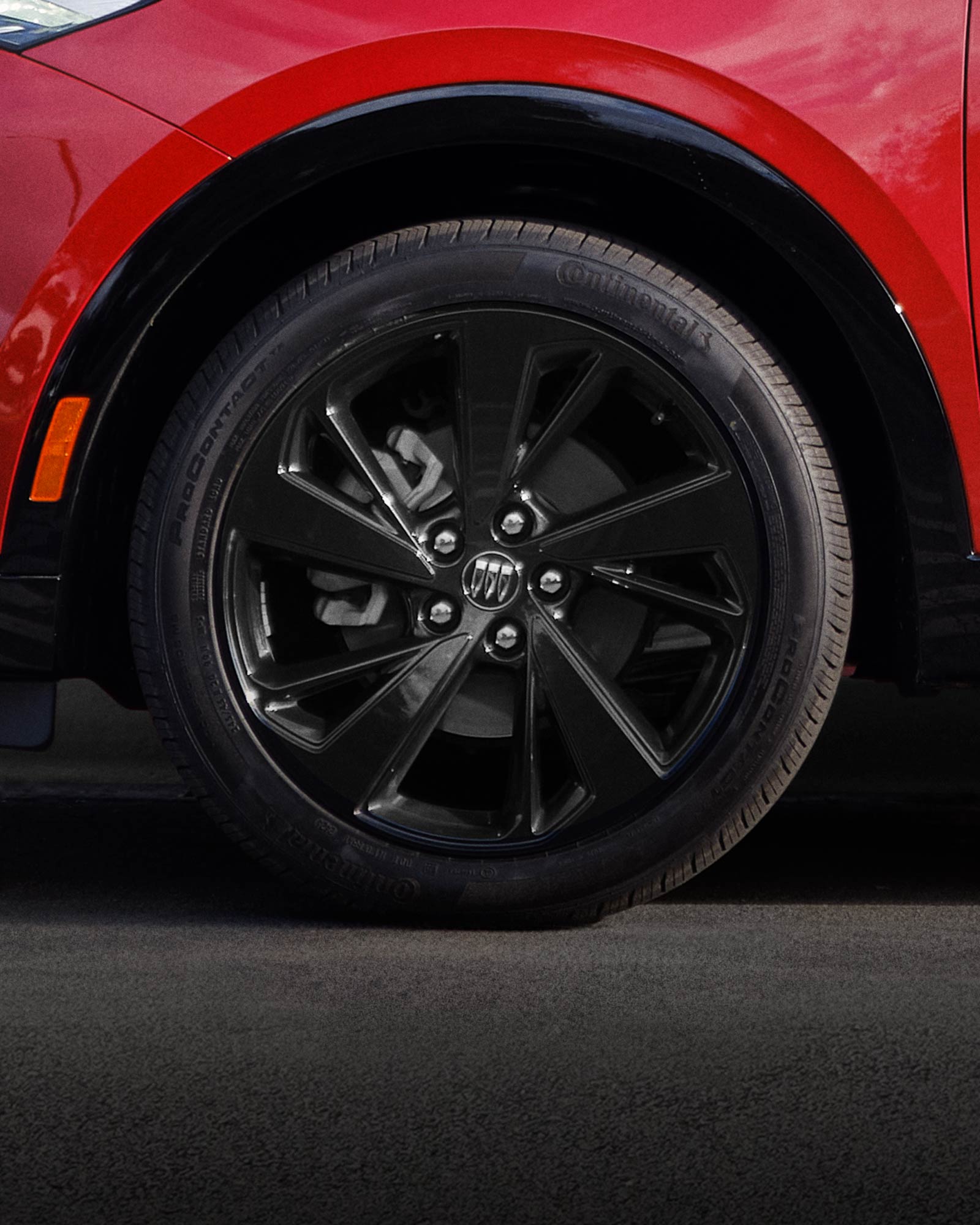 Close-up of the 20 Inch Carbon Flash Metallic Painted Alloy Wheels on the 2025 Buick Envision ST Sporty Compact SUV