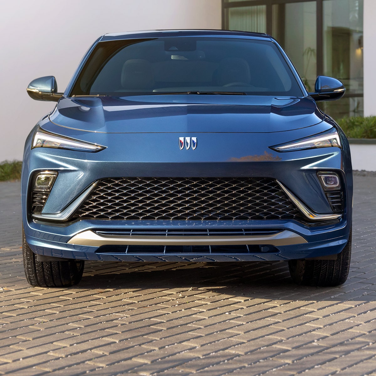 Front View of the 2026 Buick Envista and its Black Ice Chrome Grille Parked Outside of a Home