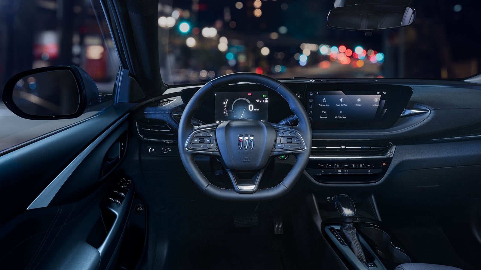 Driver Seat View of the 2026 Buick Envista Cabin and Interior Outlooking the Blurry City at Night