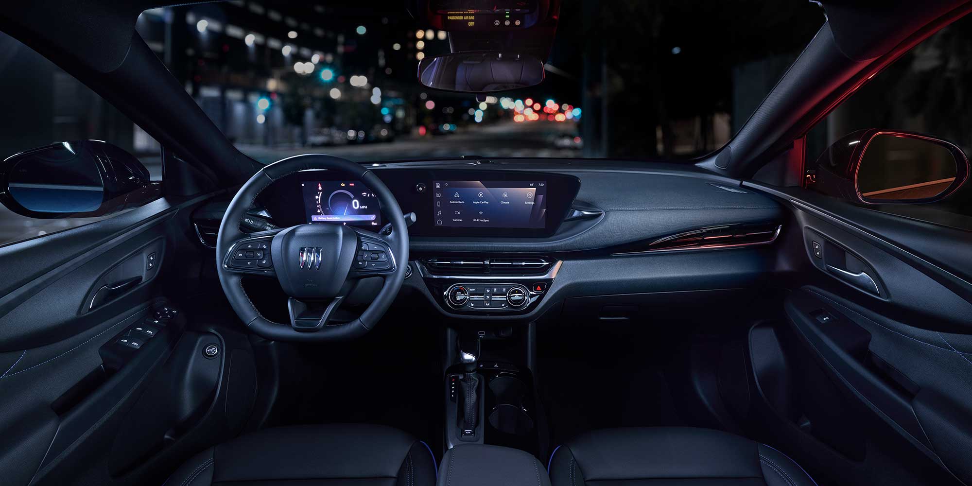 Driver Seat View of the 2026 Buick Envista Cabin and Interior Outlooking the Blurry City at Night