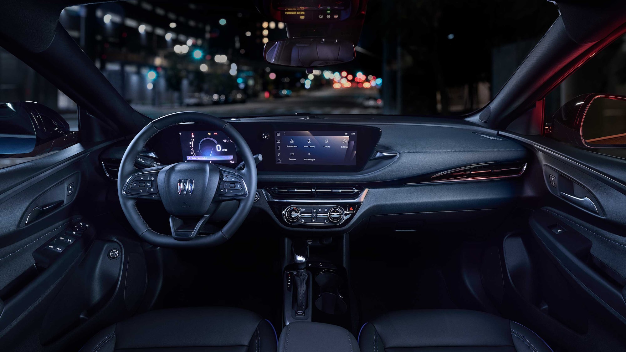 Driver Seat View of the 2026 Buick Envista Cabin and Interior Outlooking the Blurry City at Night