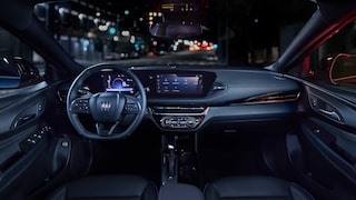 Driver Seat View of the 2026 Buick Envista Cabin and Interior Outlooking the Blurry City at Night