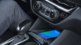 Close-up Interior View of a Smartphone Charging on the Wireless Charger in the 2026 Buick Envista