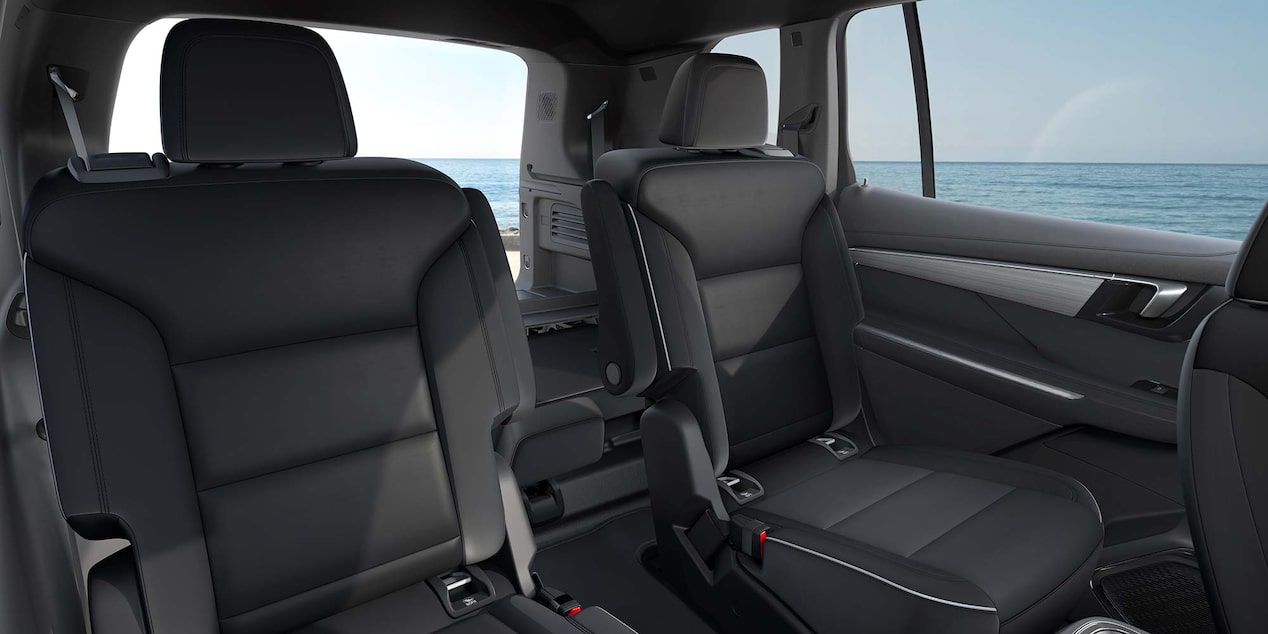 The Rear Seats of a Buick Vehicle with an Ocean View out the Window