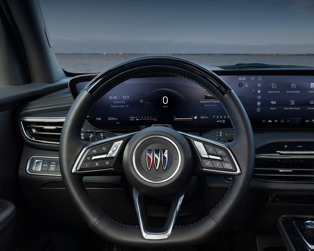 An Interior Shot of a Buick Enclave Steering Wheel with the Buick Logo and a Digital Dashboard