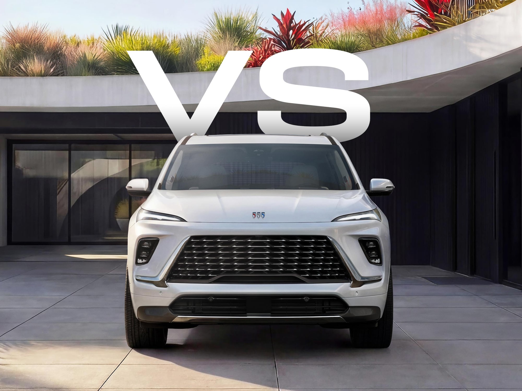 A White Buick SUV Parked in a Modern Architecturally Designed Driveway with Curved Concrete and Potted Plants