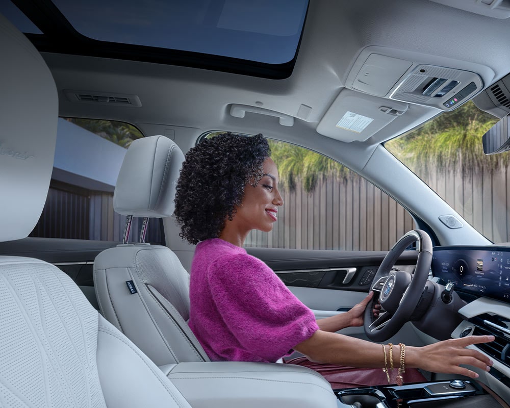 An Interior View of the White Rear Seats in a Buick Enclave with a Panoramic Sunroof
