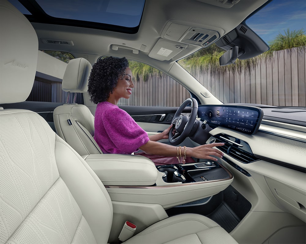 An Interior View of the White Rear Seats in a Buick Enclave with a Panoramic Sunroof