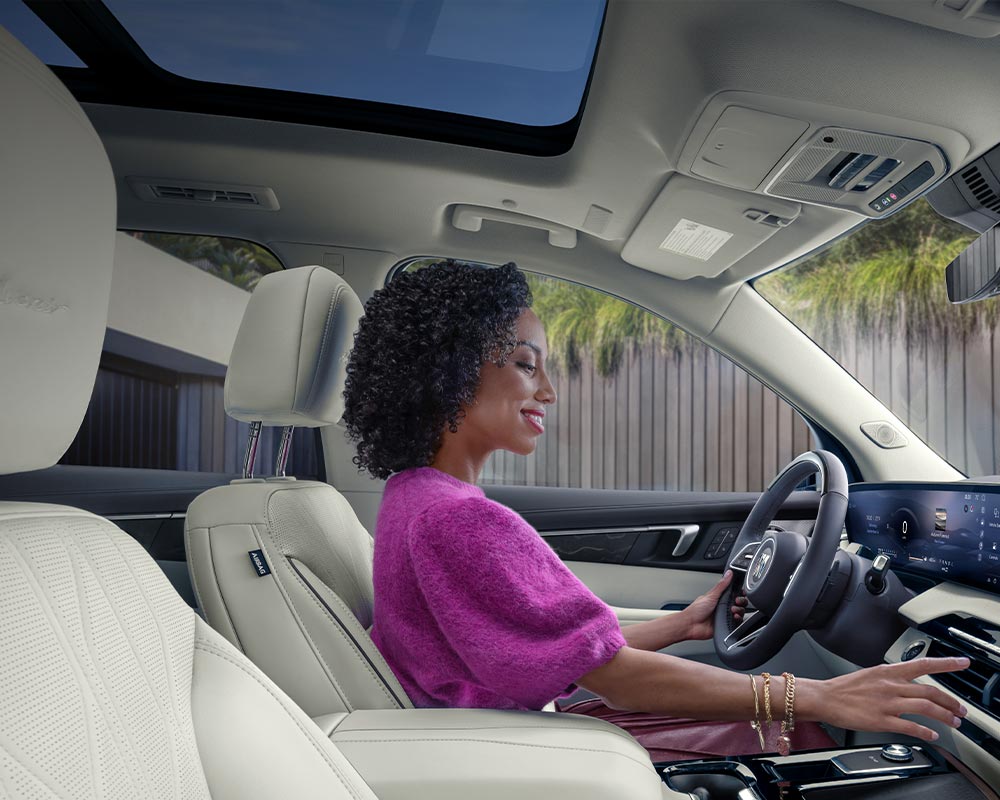 An Interior View of the White Rear Seats in a Buick Enclave with a Panoramic Sunroof