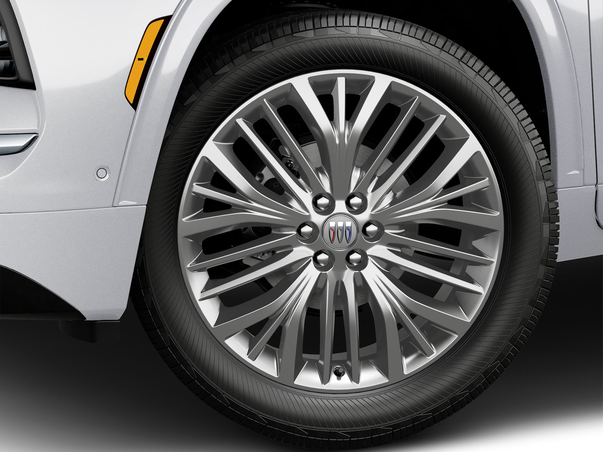 A Close-Up View of a Buick Wheel with a Chrome Finish and the Buick Tri-Shield Logo