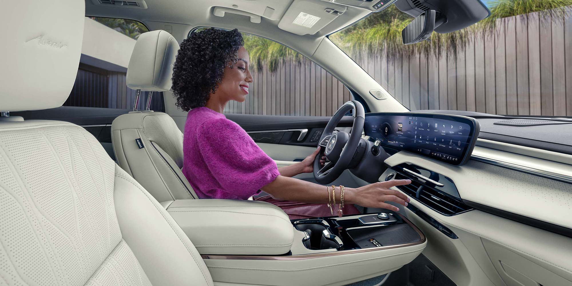 An Interior View of the White Rear Seats in a Buick Enclave with a Panoramic Sunroof