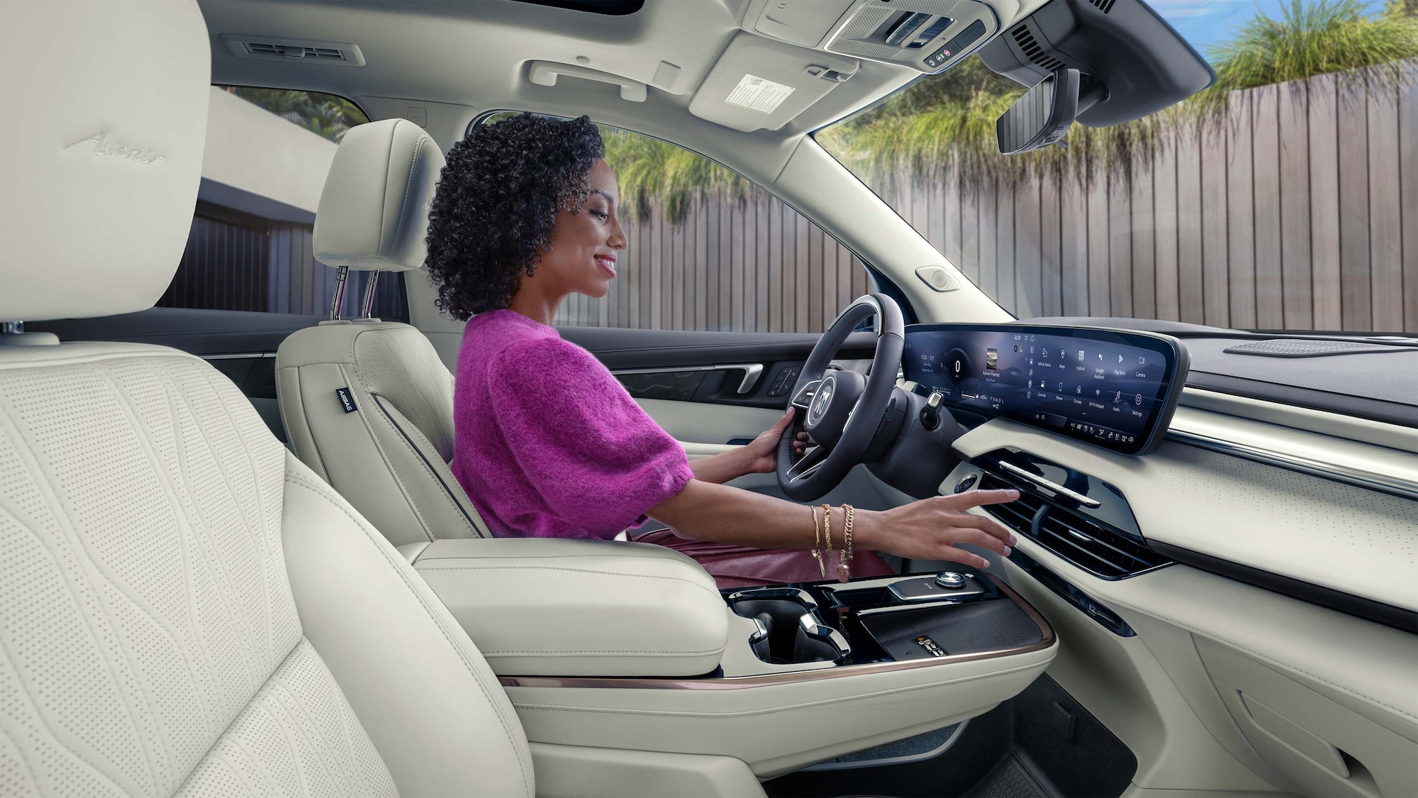 An Interior View of the White Rear Seats in a Buick Enclave with a Panoramic Sunroof