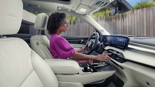 An Interior View of the White Rear Seats in a Buick Enclave with a Panoramic Sunroof