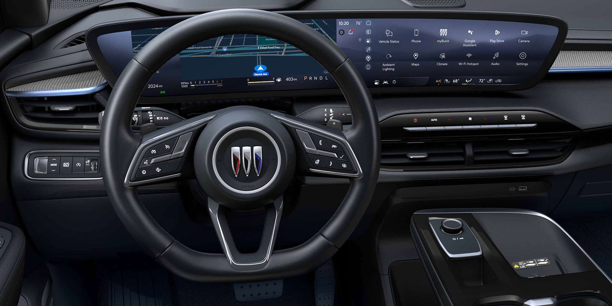 The Modern Interior Dashboard of a Buick Vehicle with a Wide Curved Digital Display and the Buick Logo on the Steering Wheel