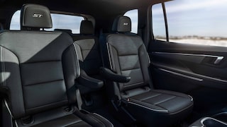 The Rear Seats of a Buick Vehicle with an Ocean View out the Window