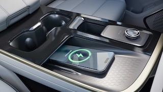 A Close-Up of the Buick Center Console with a Phone Wirelessly Charging