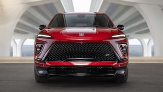A Front View of a Red Buick SUV Featuring a Large Black Grille and Sleek LED Headlights