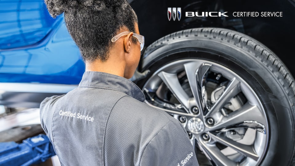 Buick Technician Mounting a New Tire on a Vehicle with Buick Logo and Text Overlay “Buick Certified Service”