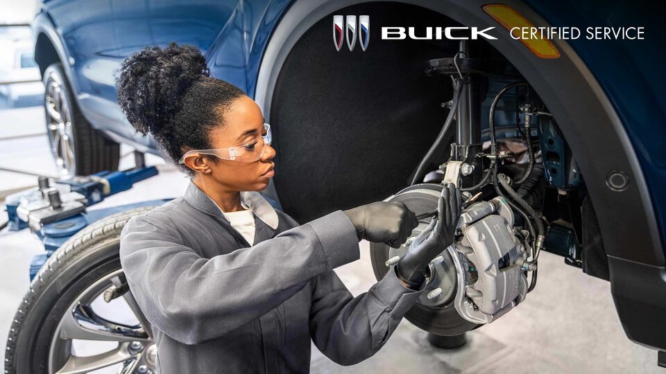 Buick Technician Working on a Vehicle’s Brake System