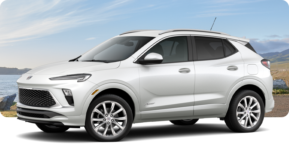 Front-Three Quarter View of a White Buick Encore GX Avenir Luxury SUV Parked Near a Beach
