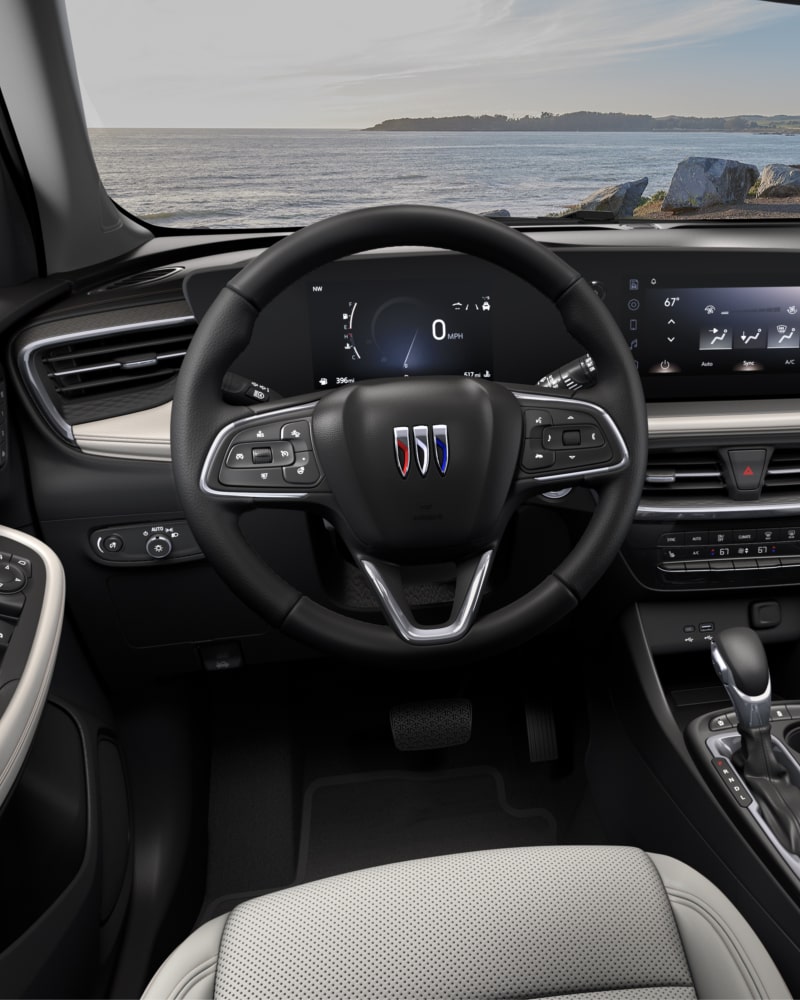 Close-up of the Buick Encore GX Avenir Interior Drivers Side View of the Steering Wheel and Dashboard