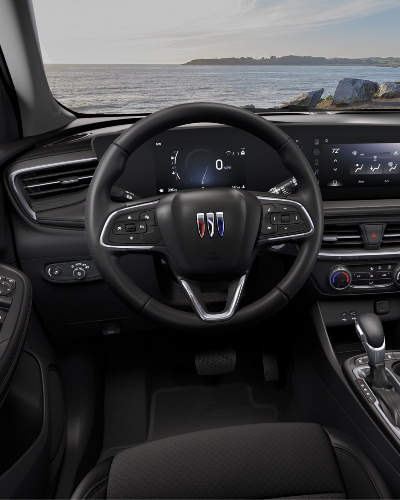 Close-up of the Buick Encore GX Interior Drivers Side View of the Steering Wheel and Dashboard