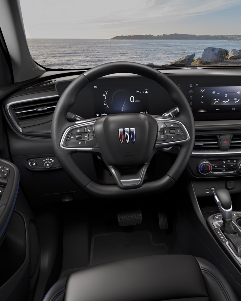 Close-up of the Buick Encore GX ST Interior Drivers Side View of the Steering Wheel and Dashboard