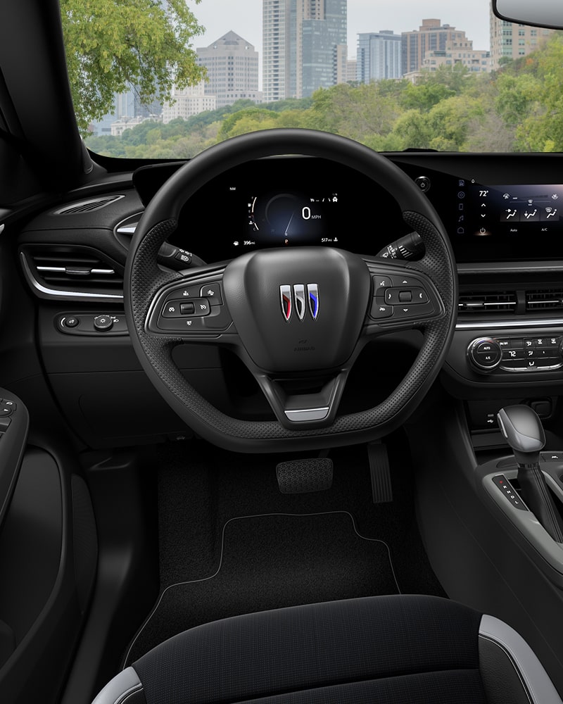 Close-up of the Buick Envista Interior Drivers Side View of the Steering Wheel and Dashboard