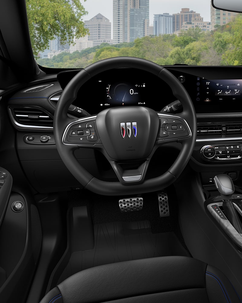 Close-up of the Buick Envista ST Interior Drivers Side View of the Steering Wheel and Dashboard