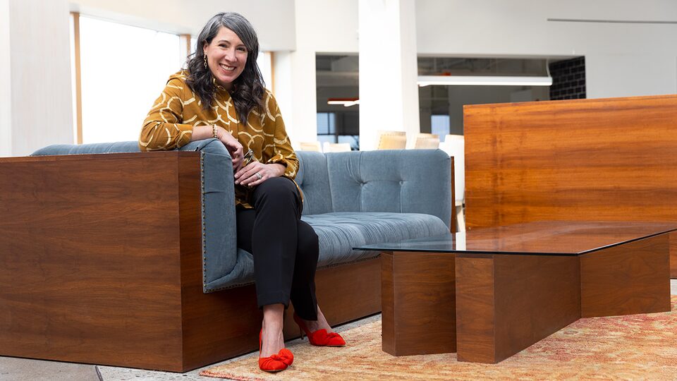 Author Kate Hrabosky Sitting on Couch